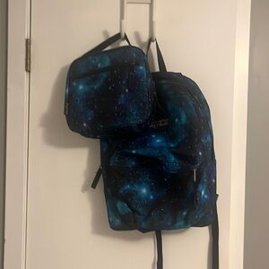 A matching Jansport lunchbox and backpack. They are both galaxy themed.
